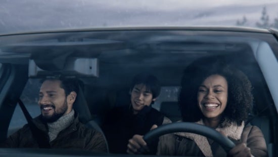 Three passengers riding in a vehicle and smiling | Waxahachie Nissan in Waxahachie TX