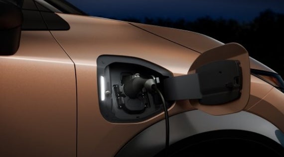 Close-up image of charging cable plugged in | Waxahachie Nissan in Waxahachie TX